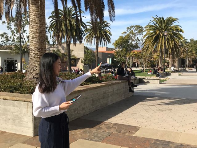 Carol Points to a location on campus